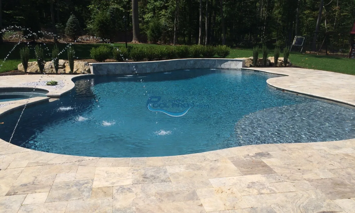 free form pool with retaining wall and shallow entry installation